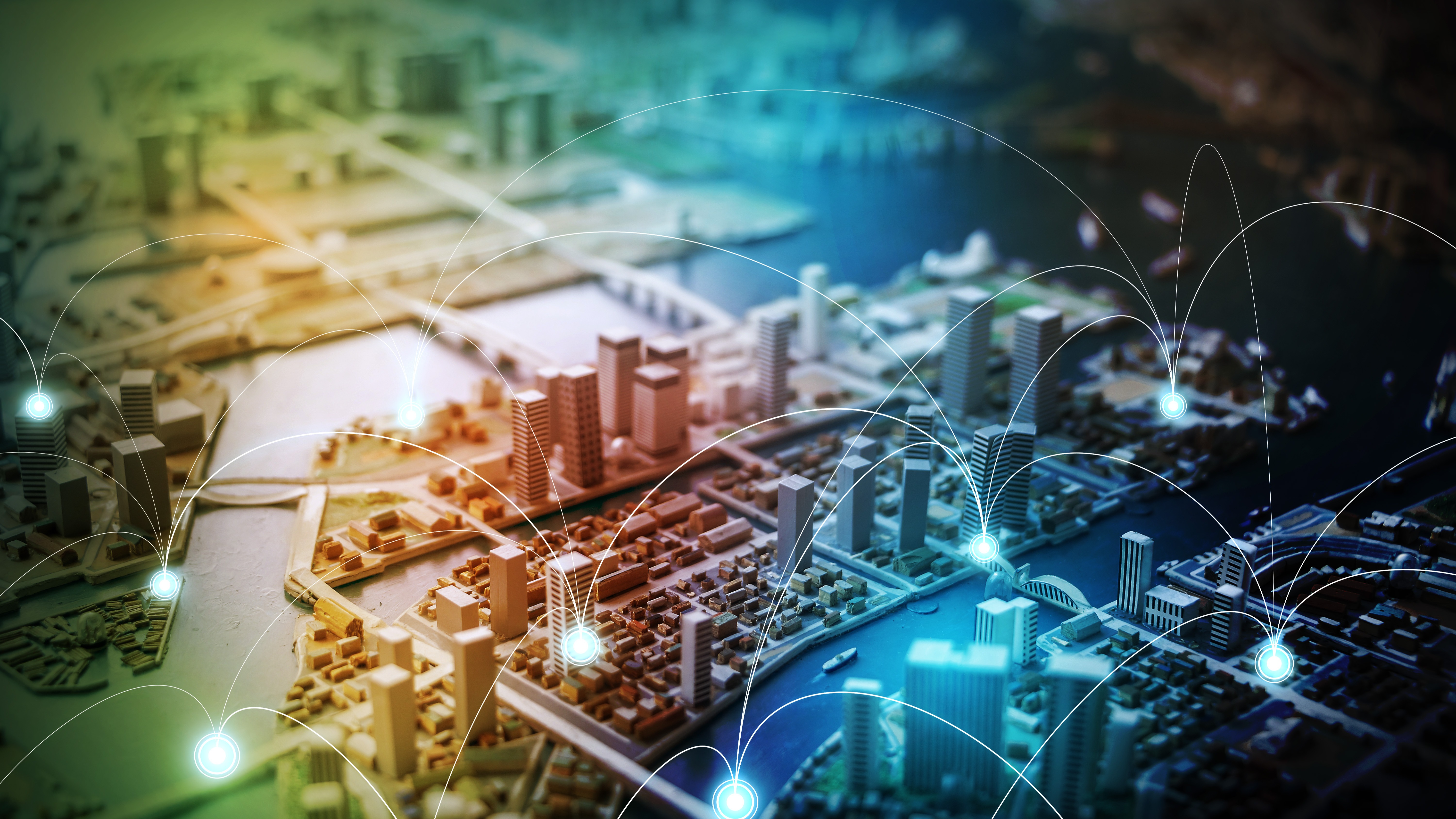 Bird's-eye view of a city where several houses are connected to symbolize smart metering and remote meter reading.